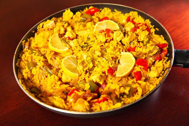 a fresh home made paella served on a frying pan