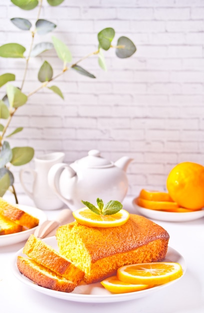 Fresh homemade baked lemon cake on the white plate.