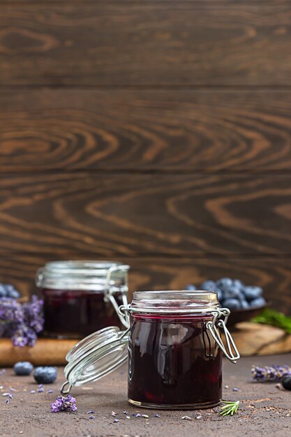 Fresh homemade blueberry, lavender and rosemary jam in jars