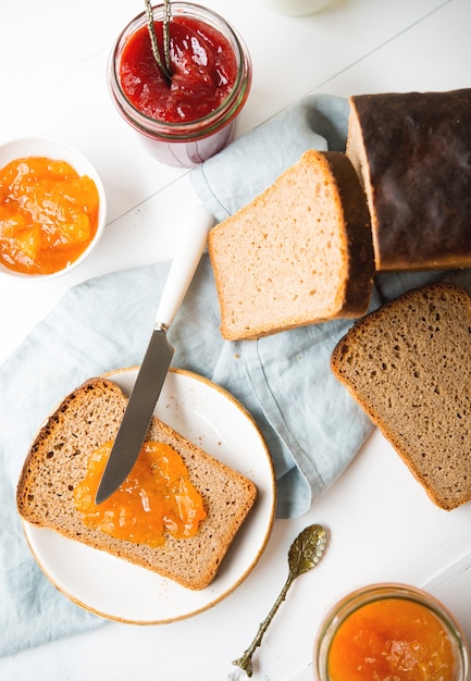 Fresh homemade bread with jam and milk