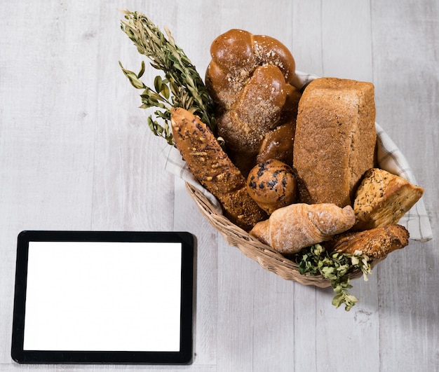 Fresh homemade bread with tablet