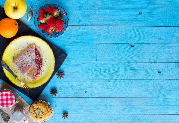 Fresh homemade crepes served on a plate with strawberries and blueberries