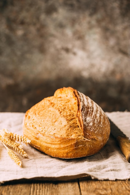 Fresh homemade crisp bread on wooden background. french bread.
bread at leaven. unleavened bread