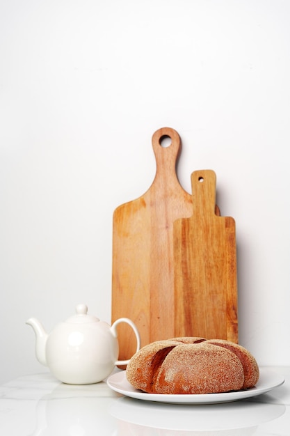 Fresh homemade crisp bread and wooden board in kitchen