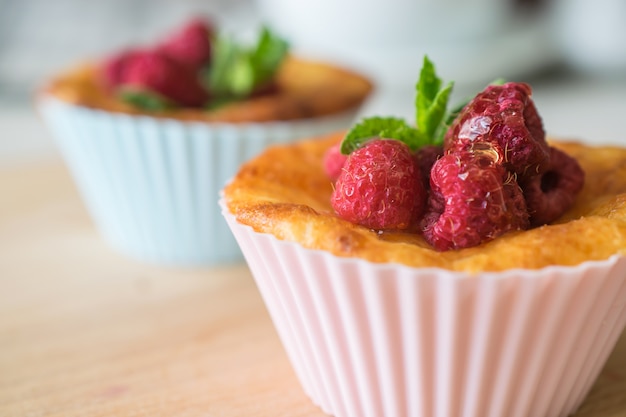 Fresh homemade delicious raspberry muffins for breakfast close up