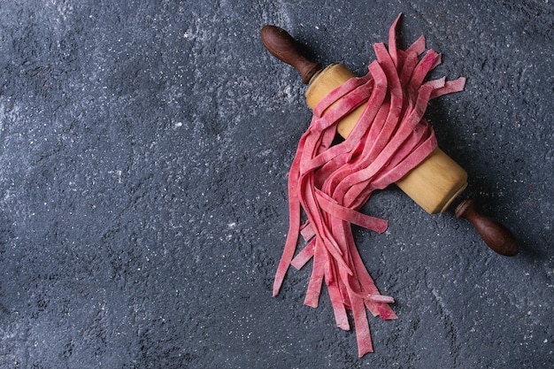 Fresh homemade pink pasta tagliatelle