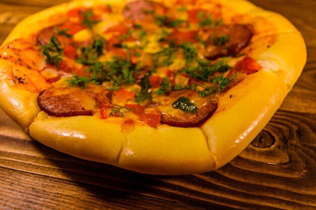 Fresh homemade pizza on rustic wooden table