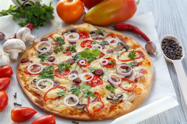 Fresh homemade pizza with tomatoes