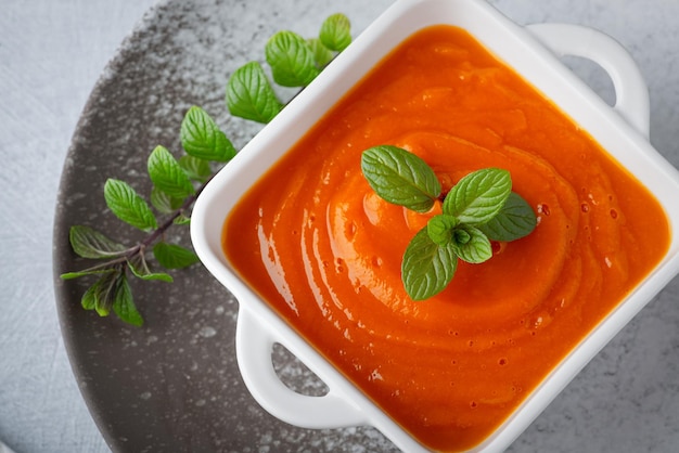 Fresh homemade pumpkin puree in a white plate