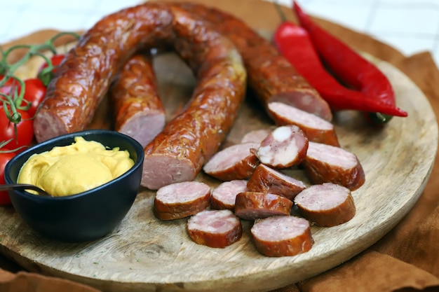 Fresh homemade sausages on a wooden tray