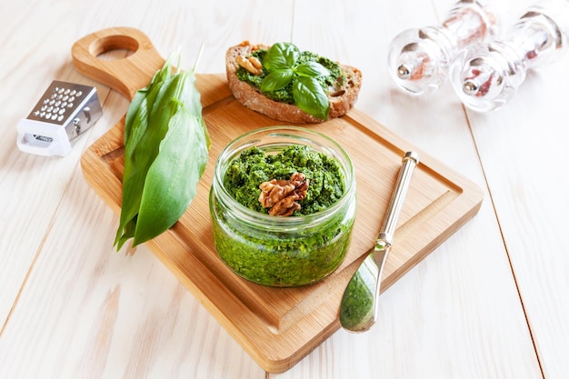 Fresh homemade wild garlic pesto made with Bear Leek herbs delicious savory sauce for Italian pasta and ingredients for its cookingx9