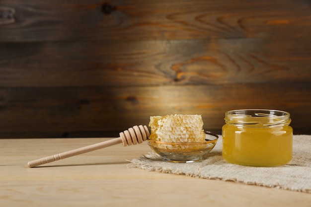 fresh honey is on wooden background