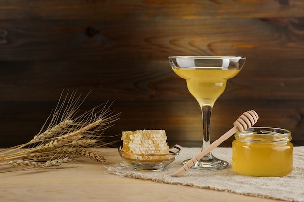 fresh honey is on wooden background