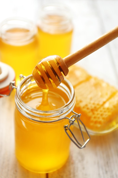 Fresh honey on wooden table