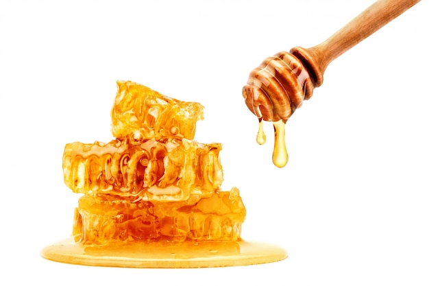 Fresh honeycomb with honey on white.