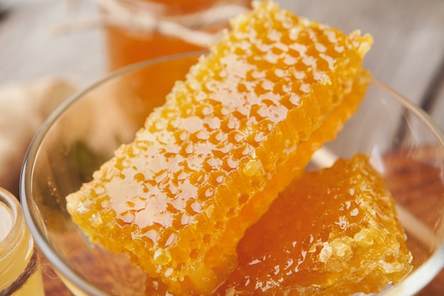 Fresh honeycombs in glass bowl, closeup