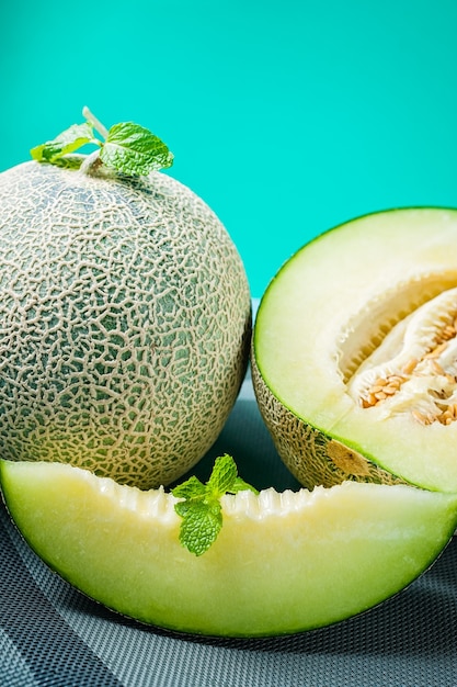 Fresh Honeydew melon on wooden table, healthy food.