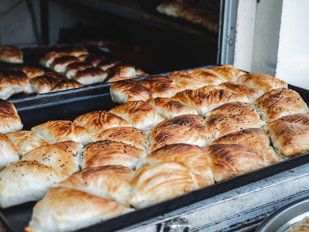 Fresh hot buns lying on a tray