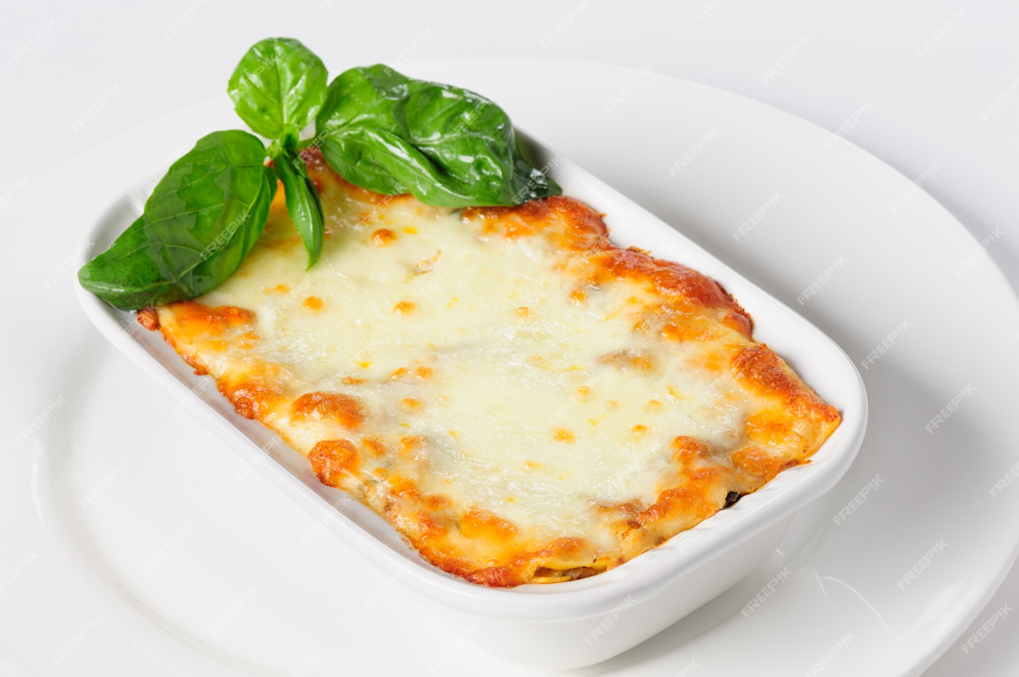 Premium Photo | Fresh hot lasagna on white