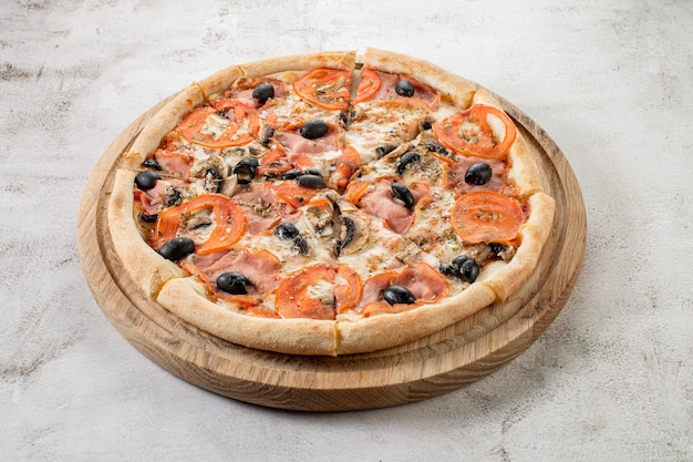 Fresh hot meat pizza on the white concrete background Flat lay