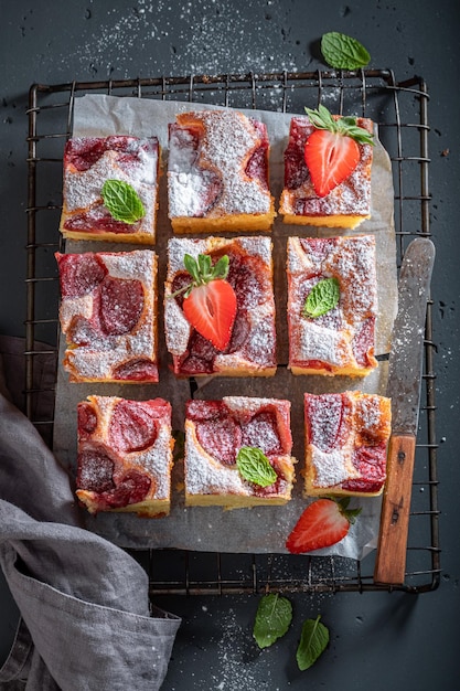 Fresh and hot strawberry cake made of yeast dough