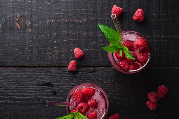 Fresh ice cold berry cocktails with mint leaves