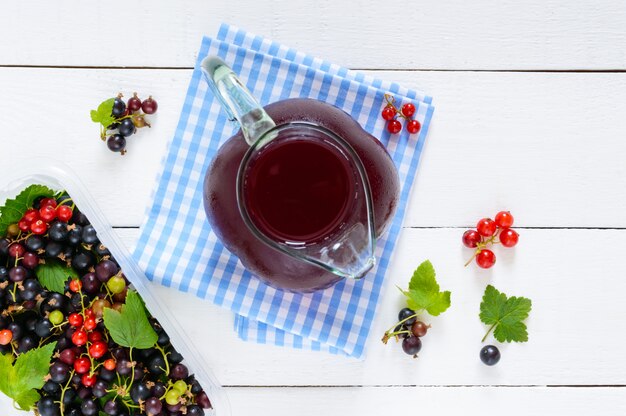 Fresh ice tea with berries in a glass jar