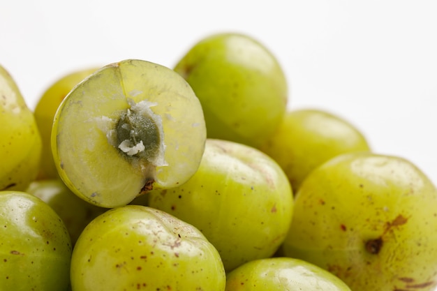 Fresh Indian gooseberry in wooden bowl