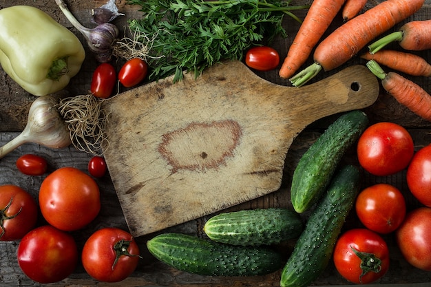 Fresh ingredients for cooking,  tomatoes, carrots  and cucumbers