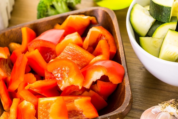 Fresh ingredients for preparing roasted mixed vegetables on the table.