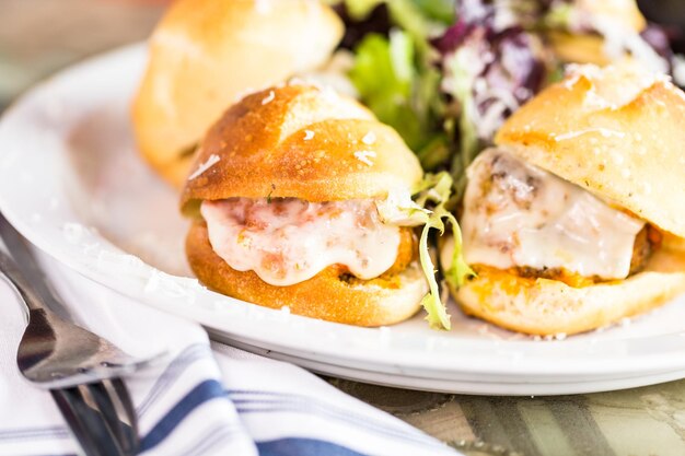 Fresh Italian meatball sliders on the table in Italian restaurant.