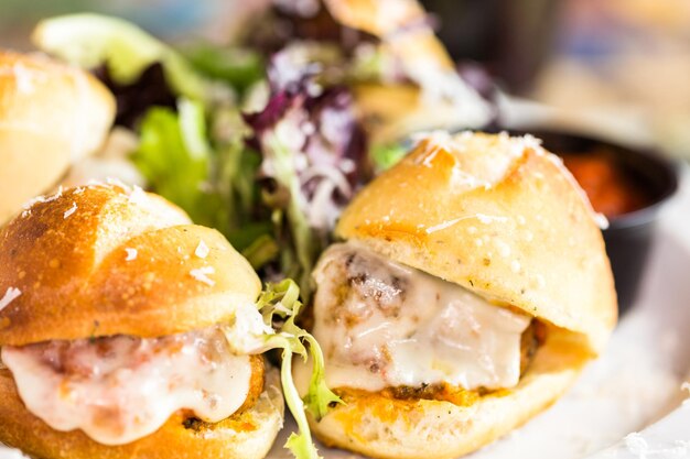 Fresh Italian meatball sliders on the table in Italian restaurant.