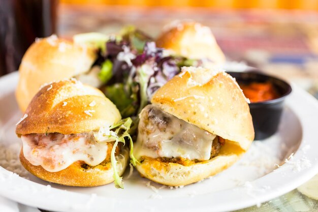 Fresh Italian meatball sliders on the table in Italian restaurant.