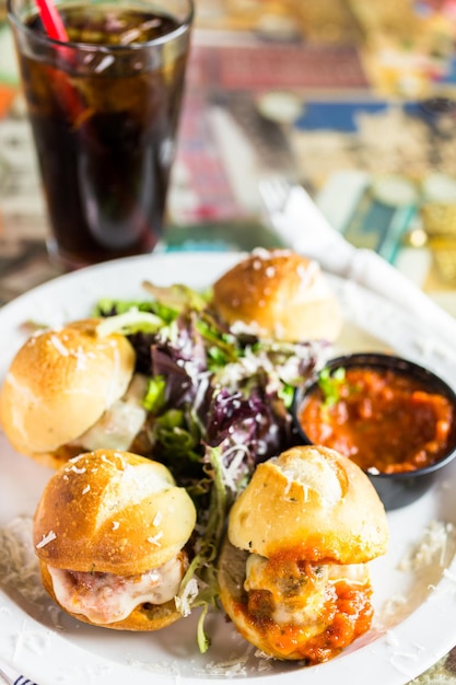 Fresh Italian meatball sliders on the table in Italian restaurant.