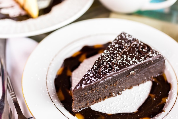 Fresh Italian Old Fashioned Chocolated cake with coffee on the table.