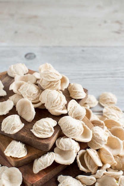 Fresh italian pasta orecchiette made from whole wheat flour