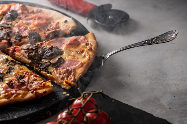 Fresh Italian pizza with bacon and mushrooms.