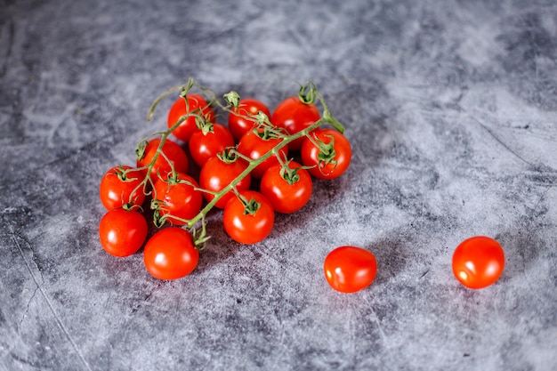 Fresh italian tomatoes cherry on dark background