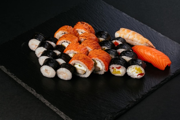 Fresh japans sushi on a black background