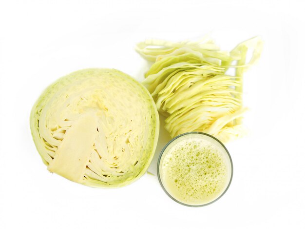 Fresh juice of cabbage on white wall with copy space top view