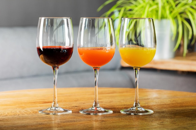 Fresh juice in a glass on a wooden table The concept of healthy eating