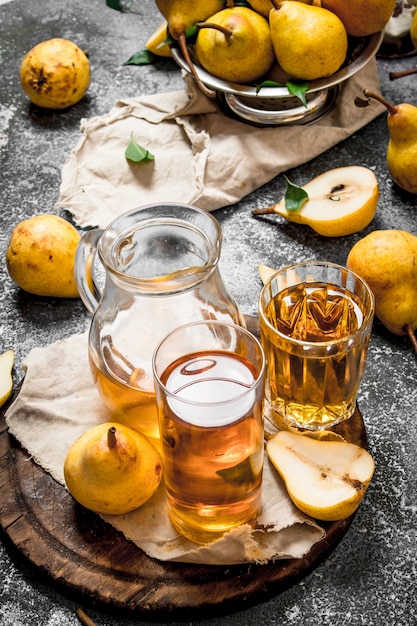 The fresh juice of pears on rustic background