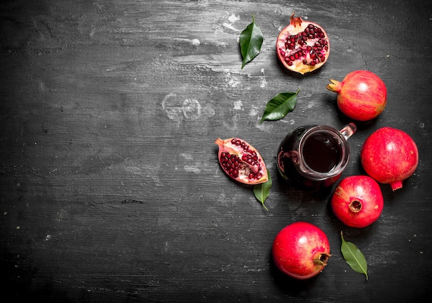 The fresh juice of ripe pomegranate. The black chalckboard.