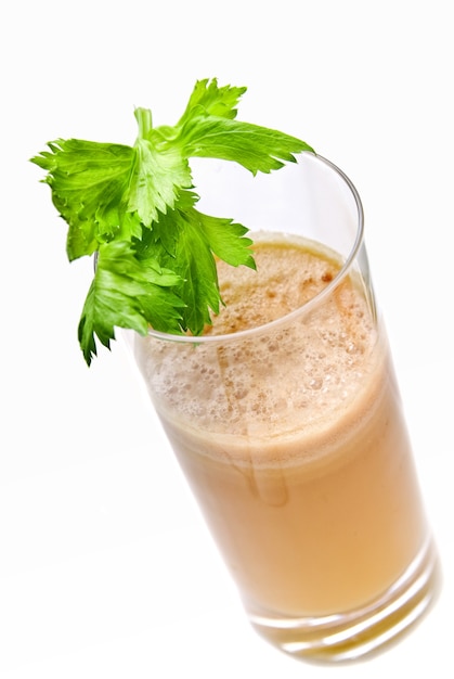 Fresh juices from carrot and parsley in glasses isolated on white