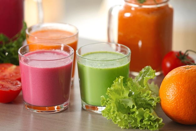 Fresh juices and ingredients on table