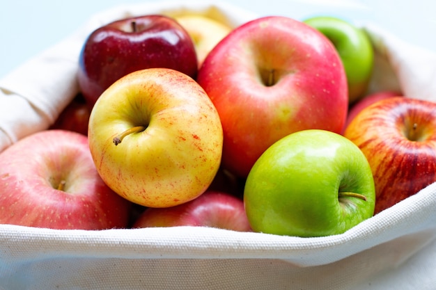 Fresh juicy apples in cloth bag