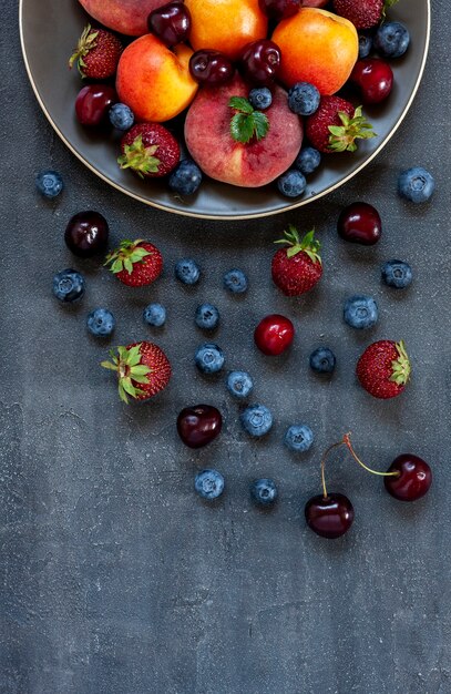 Fresh juicy berries and fruits on a plate