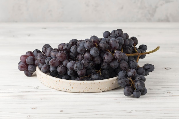 fresh juicy black and green grape on table