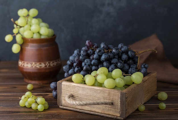 fresh juicy black and green grape on table