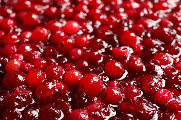 Fresh juicy cranberry sauce as background closeup